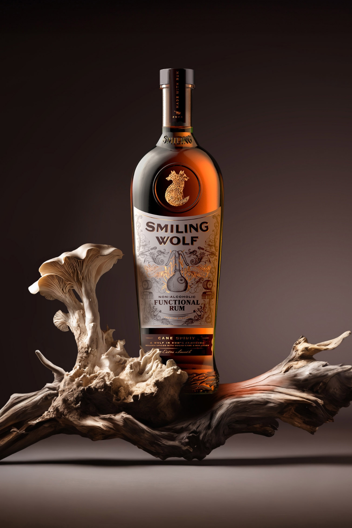 A bottle of Smiling Wolf non-alcoholic Functional Rum resting on driftwood with oyster mushrooms against a dark background.